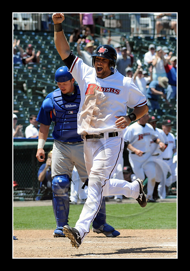 Emerson Frostad celebrates as he crosses the plate as he scores the winning run.