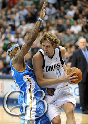 4 Dirk Nowitzki guarded by Carmelo Anthony
