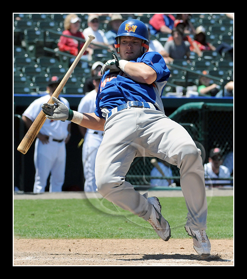 Chin Music - Midland RockHounds catcher is brushed back from the plate with an inside pitch.