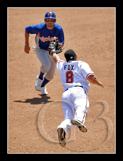 As I was shooting from a high vantage point I was able to capture third baseman Adam Fox as dives for a ball hit passed him. I liked this shot because this angle makes him look as he's about to dive right into the runner.