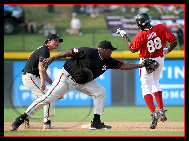 SPORT Baseball Former Oakland Raider Warren Sapp of the Black Sox makes a tag on former Dallas Cowboy Micheal Irvin goes into second base