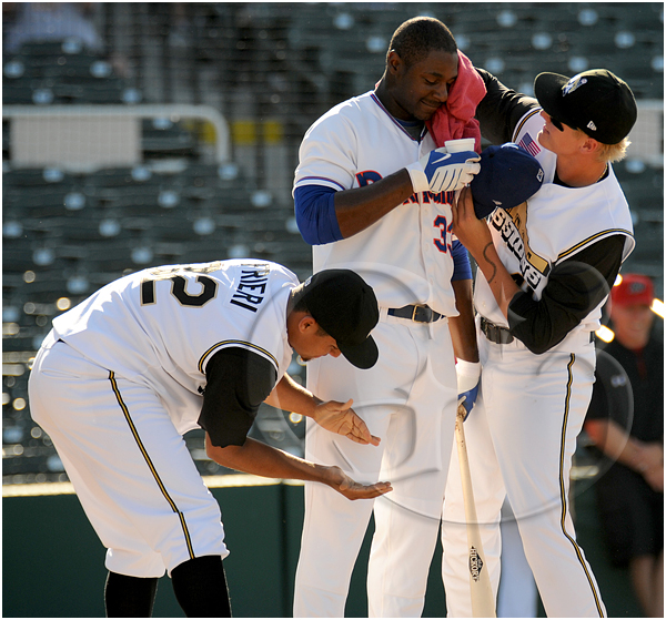 3 Midland Rockhounds first baseman Chris Carter #33 is cooled off and given water by his teammates after hitting 10 home runs in the first round of the home run derby