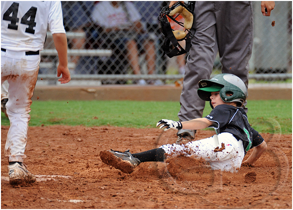 9 It rained quite a bit during this game and on this play the runner slid into home and this is where he stopped, about a foot in front of home plate! The mud kept him from sliding and he was stopped immediately by the mud. All his teammates were laughing, and so was I. Been there, done that.