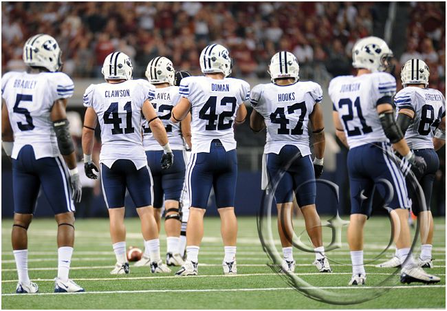 SPORT NCAA FOOTBALL The BYU defense awaits the return of the Oklahoma offense to the field during a time out