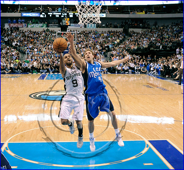 NBA: MAR 18 Spurs at Mavericks Tony Parker #9 is fouled by Dallas Mavericks power forward Dirk Nowitzki #41
